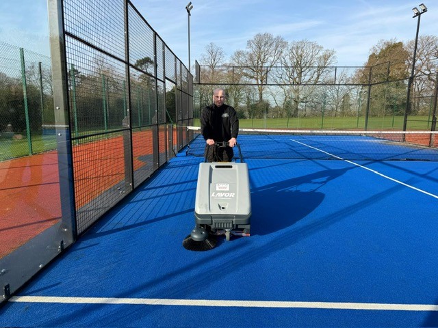 Lavor SWL 700 ET Court Deluxe indoor sports sweeper using its large dust panel filter and electric filter shaker.