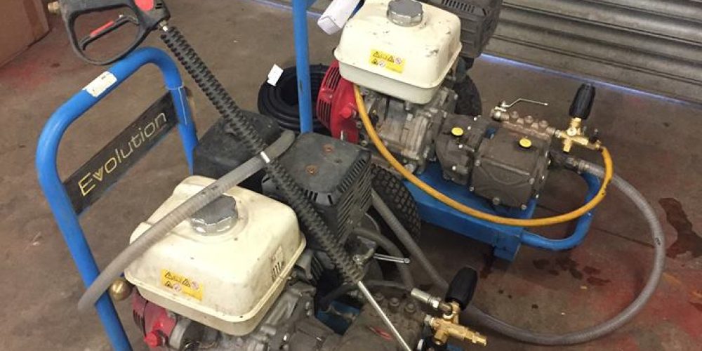 A professional service engineer conducting preventative winter maintenance and anti-frost checks on a mobile industrial pressure washer unit in Darlington.