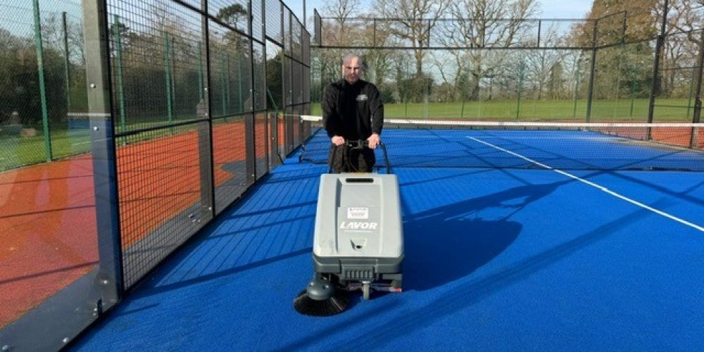 Lavor SWL 700 ET Court Deluxe indoor sports sweeper using its large dust panel filter and electric filter shaker.