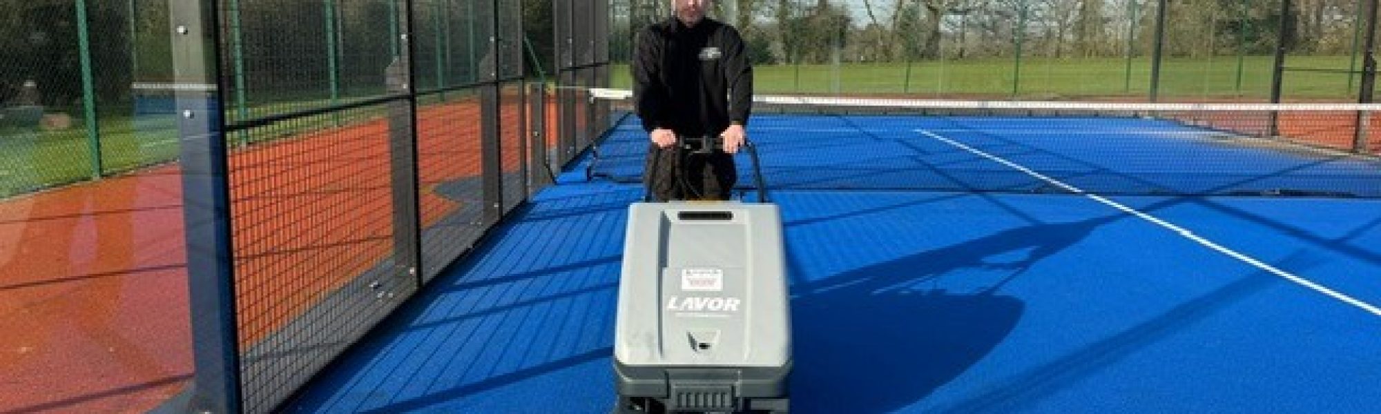 Lavor SWL 700 ET Court Deluxe indoor sports sweeper using its large dust panel filter and electric filter shaker.
