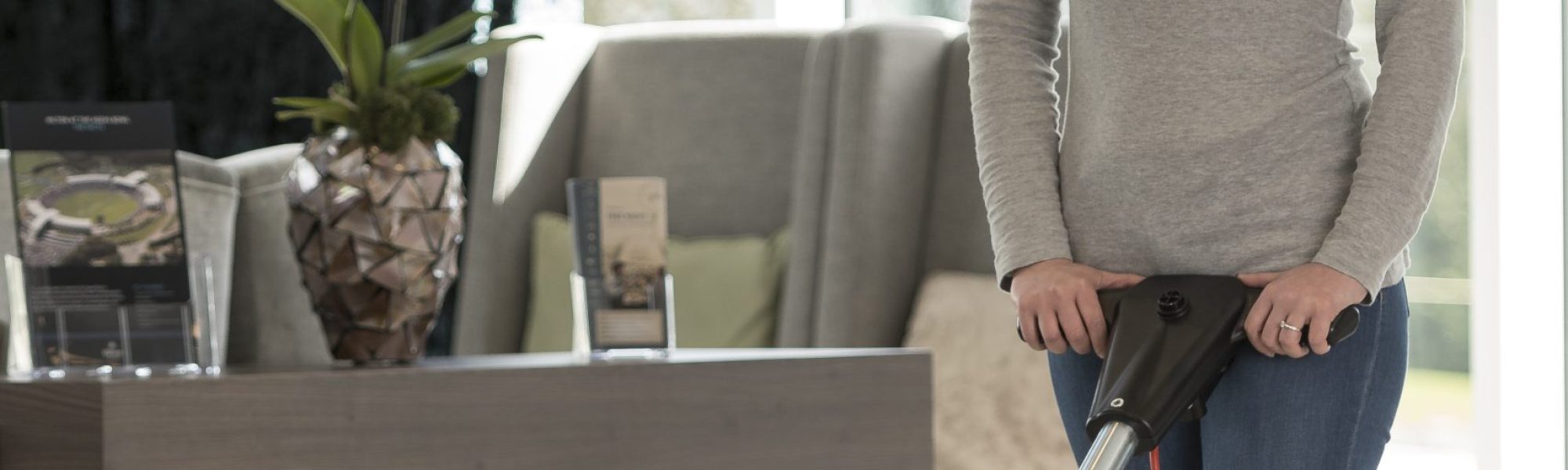 Lady cleaning with Truvox Orbis Eco