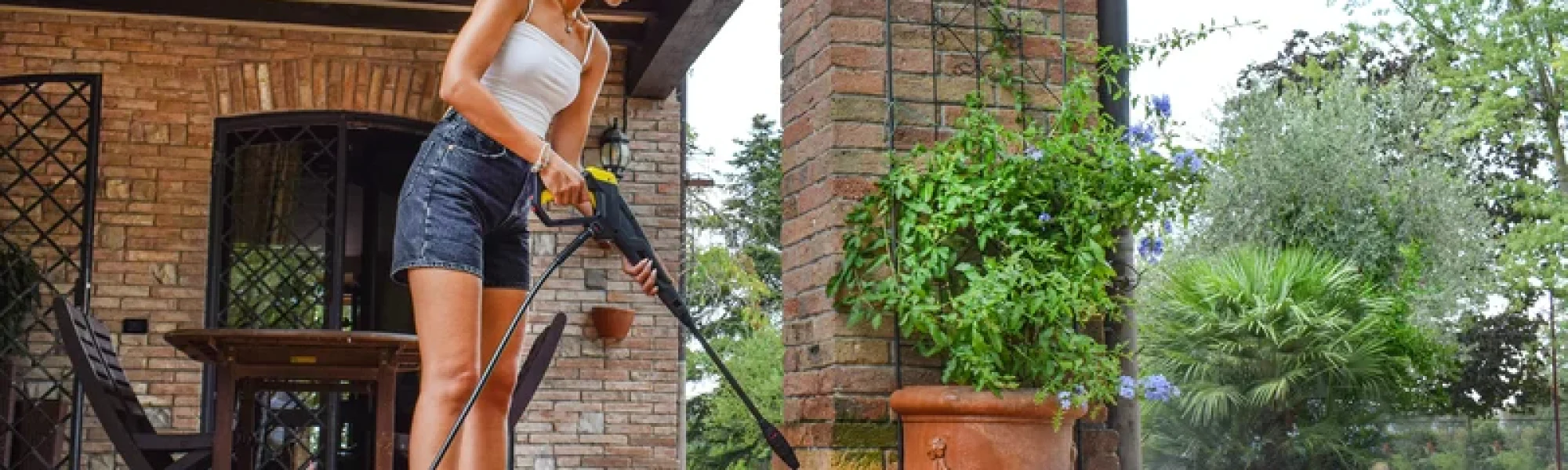 Using a Columbus UK Pressure Washer machine on a patio